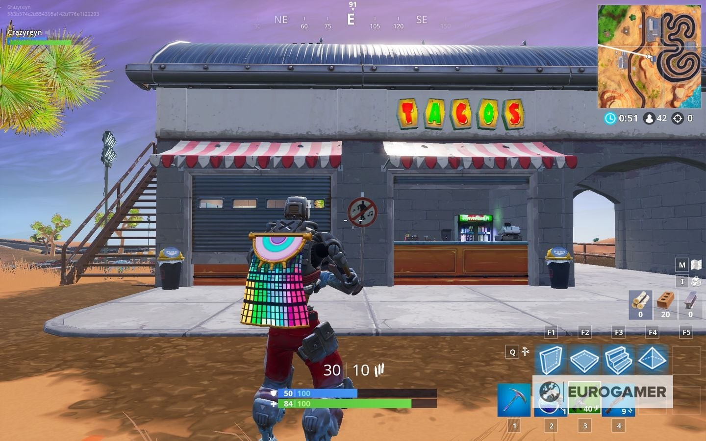 Biển báo cấm nhảy đặt trước cửa hàng taco tại đường đua sa mạc Fortnite