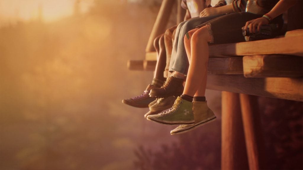 Hình ảnh chụp màn hình Lost Records: Bloom &amp; Rage với chân của bốn nhân vật chính khi còn là thiếu niên, đung đưa trên cây cầu