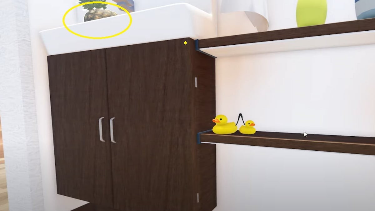 Vị trí quả dứa Pineapple trên kệ cao nhà vệ sinh Secret Staycation